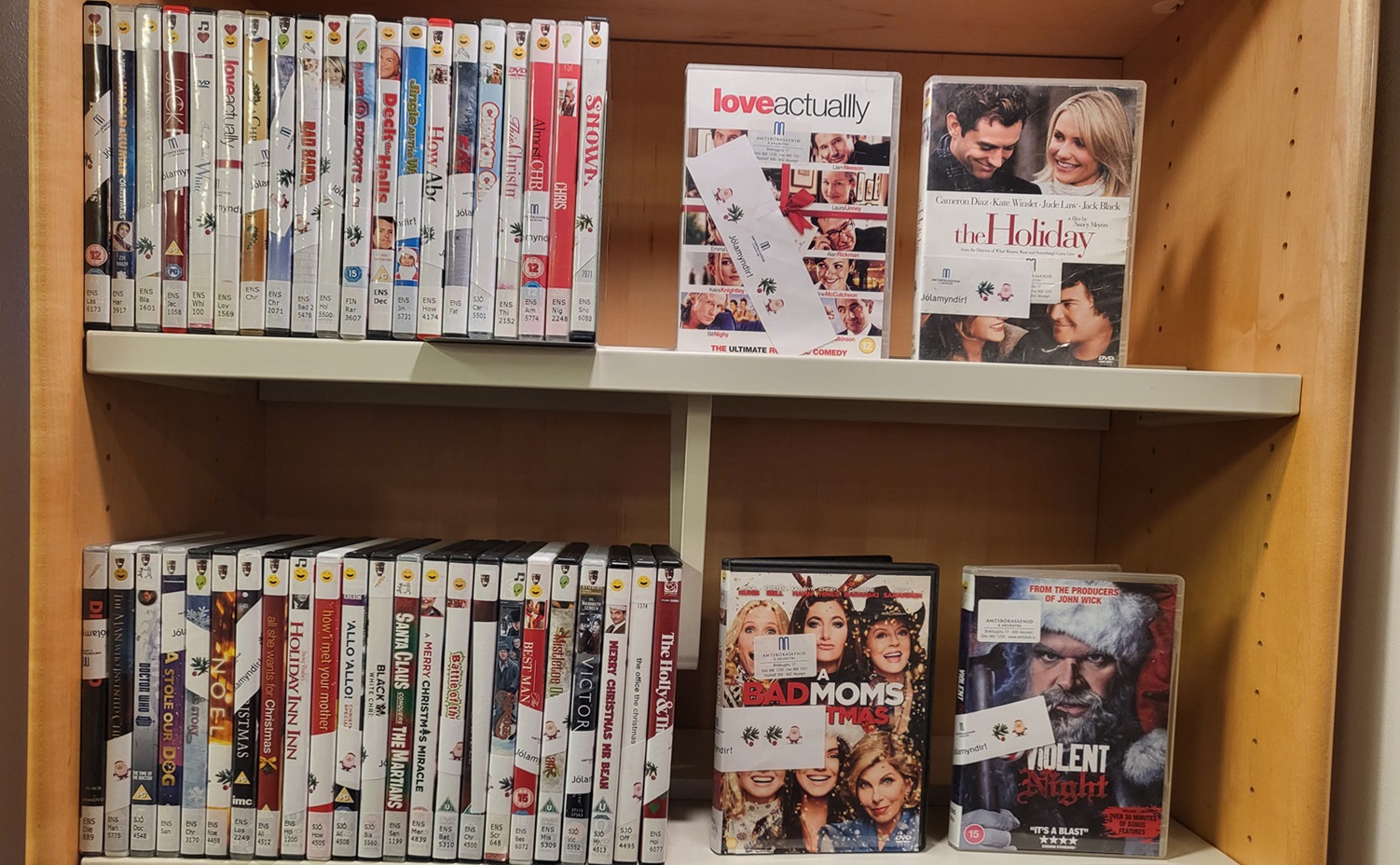 Two shelves with Christmas movies on DVD format